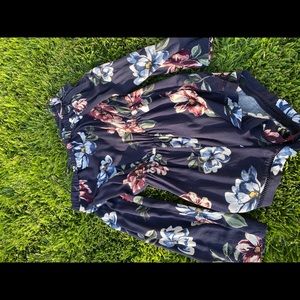 Navy blue romper with floral pattern